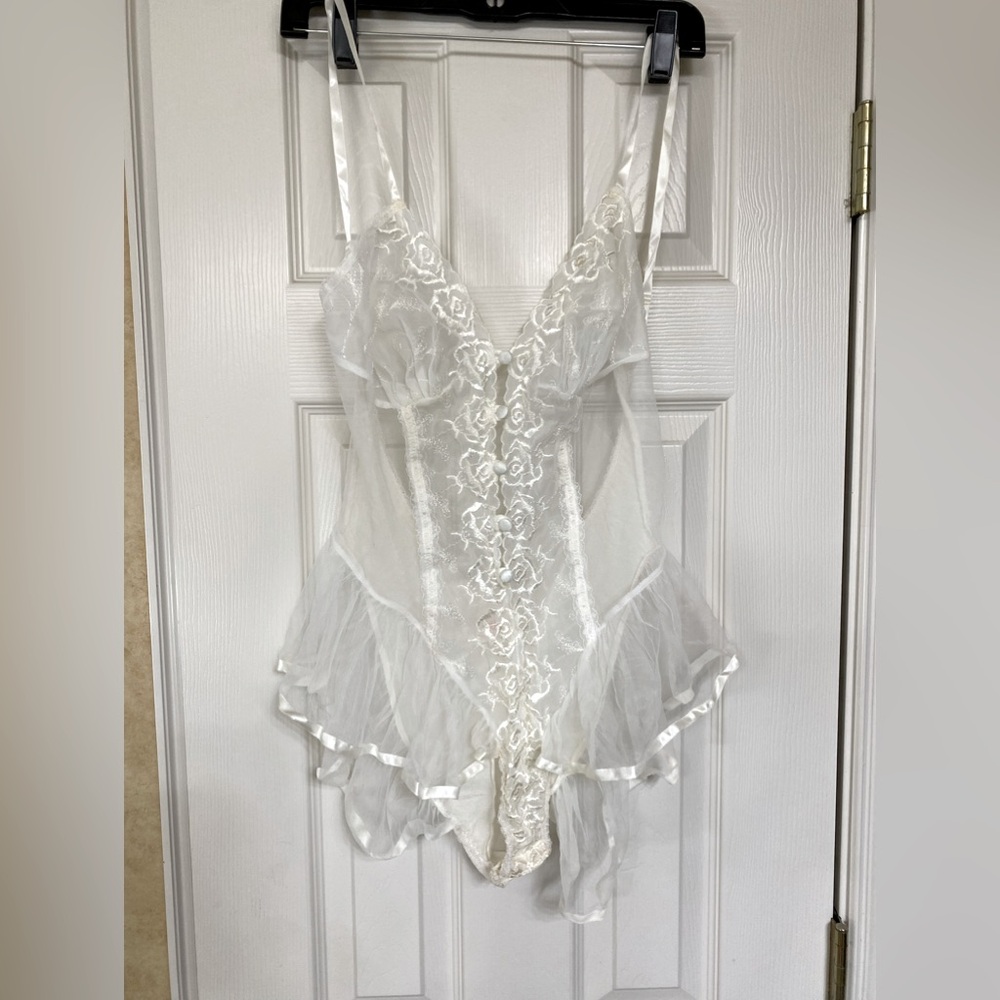 Shirley of Hollywood Size Lg, new w/o tags. Could be used after a wedding. White